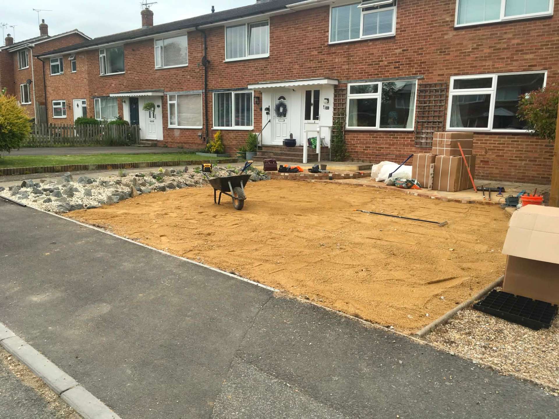 Front garden driveway preparation with sand base and rockery border